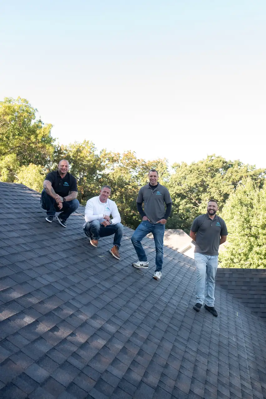 The JBS Roofers team on a finished roof in Mid-Missouri
